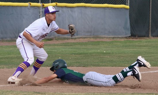 Lemoore's Jimmy Caldera tags out El Diamante's Mikey Ramirez at third base in the Tigers' loss Friday to the Miners.